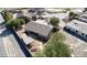 An aerial view shows the house with a private, landscaped backyard and covered patio at 5480 Lincolnwood Ct, Pahrump, NV 89061