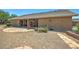 Spacious backyard featuring a covered patio and ample space for gardening, recreation, and entertaining at 5480 Lincolnwood Ct, Pahrump, NV 89061