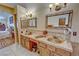 Bathroom vanity featuring copper sinks, stylish hardware, and decorative mirrors at 5480 Lincolnwood Ct, Pahrump, NV 89061