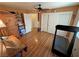 Bedroom features a treadmill, a closet and hardwood floors at 5480 Lincolnwood Ct, Pahrump, NV 89061