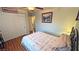 Bedroom features a bed, closet and hardwood floors at 5480 Lincolnwood Ct, Pahrump, NV 89061