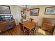 Dining room with wooden table and chairs under a decorative light fixture at 5480 Lincolnwood Ct, Pahrump, NV 89061