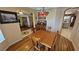 Cozy dining room with hardwood floors, decorative lighting, and classic furnishings at 5480 Lincolnwood Ct, Pahrump, NV 89061