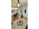 Welcoming foyer with decorative tile flooring, adjacent to a dining area and featuring a stylish light fixture at 5480 Lincolnwood Ct, Pahrump, NV 89061