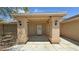 Inviting front entry with covered porch and stylish architectural columns at 5480 Lincolnwood Ct, Pahrump, NV 89061