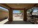 Picturesque view from the covered front porch overlooking the landscaped front yard and the neighborhood at 5480 Lincolnwood Ct, Pahrump, NV 89061