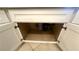 Under-sink view shows modern plumbing, garbage disposal, and custom cabinet at 5480 Lincolnwood Ct, Pahrump, NV 89061