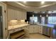 Charming kitchen featuring white cabinets, recessed lighting and a view to the backyard at 5480 Lincolnwood Ct, Pahrump, NV 89061
