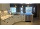 Bright kitchen featuring white cabinets, marble countertops, and stainless steel appliances at 5480 Lincolnwood Ct, Pahrump, NV 89061