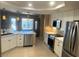 Bright kitchen featuring white cabinets, stainless steel appliances and light countertops at 5480 Lincolnwood Ct, Pahrump, NV 89061