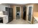 Kitchen area with stainless steel refrigerator and a pantry, offering ample storage at 5480 Lincolnwood Ct, Pahrump, NV 89061