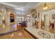 Open-concept living area with hardwood floors and bright, neutral paint creating an inviting atmosphere at 5480 Lincolnwood Ct, Pahrump, NV 89061