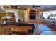 Cozy living room features wood floors, large windows, and neutral paint creating a bright atmosphere at 5480 Lincolnwood Ct, Pahrump, NV 89061