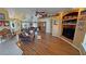 Living room featuring hardwood floors, neutral paint, lots of natural light, and open concept design at 5480 Lincolnwood Ct, Pahrump, NV 89061