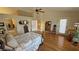 Bright and airy main bedroom with hardwood floors, and a ceiling fan at 5480 Lincolnwood Ct, Pahrump, NV 89061