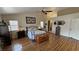 Spacious main bedroom boasts wood floors, ceiling fan, and ensuite access at 5480 Lincolnwood Ct, Pahrump, NV 89061