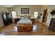 Spacious main bedroom with hardwood floors and ceiling fan at 5480 Lincolnwood Ct, Pahrump, NV 89061