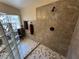 Bright tile shower with glass block and stylish fixtures at 5480 Lincolnwood Ct, Pahrump, NV 89061