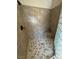 Beautiful shower featuring decorative tiles and a glass block wall at 5480 Lincolnwood Ct, Pahrump, NV 89061