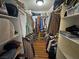 Organized walk-in closet with hardwood floors and custom shelving provides ample storage at 5480 Lincolnwood Ct, Pahrump, NV 89061
