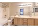 Bathroom with double sinks, framed mirror, and tub with shower at 5710 E Tropicana Ave # 1114, Las Vegas, NV 89122