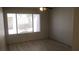Bedroom with neutral paint, ceiling fan, and a large window at 5710 E Tropicana Ave # 1114, Las Vegas, NV 89122