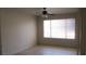 Bright bedroom featuring a ceiling fan and a large window that brings in natural light at 5710 E Tropicana Ave # 1114, Las Vegas, NV 89122