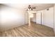 Empty bedroom features laminate wood flooring and a large doorway at 5710 E Tropicana Ave # 1114, Las Vegas, NV 89122