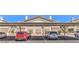 Exterior of building with designated, covered parking spots on a sunny day at 5710 E Tropicana Ave # 1114, Las Vegas, NV 89122