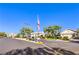 Welcoming community entrance with well-maintained landscaping, mature trees, and clear signage at 5710 E Tropicana Ave # 1114, Las Vegas, NV 89122