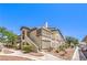 Beautiful exterior of a multi-Gathering home with well maintained landscaping, sidewalks, and covered parking at 5710 E Tropicana Ave # 1114, Las Vegas, NV 89122