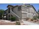 Two-story condo with covered patio and desert landscaping at 5710 E Tropicana Ave # 1114, Las Vegas, NV 89122