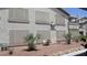 Building exterior showcasing muted shades, drought resistant landscaping, and covered windows at 5710 E Tropicana Ave # 1114, Las Vegas, NV 89122
