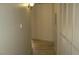 Hallway with wood floors, neutral paint, and closet storage creating an open feel at 5710 E Tropicana Ave # 1114, Las Vegas, NV 89122