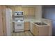 Bright kitchen with white appliances and updated countertops at 5710 E Tropicana Ave # 1114, Las Vegas, NV 89122