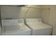 Functional laundry area with a white washer and dryer, maximizing convenience at 5710 E Tropicana Ave # 1114, Las Vegas, NV 89122