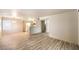 Open floor plan living area with laminate flooring and view of the kitchen and dining area at 5710 E Tropicana Ave # 1114, Las Vegas, NV 89122