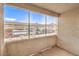 Screened patio overlooking the complex carport and landscaped grounds for relaxed outdoor living at 5710 E Tropicana Ave # 1114, Las Vegas, NV 89122