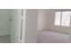 Clean, carpeted bedroom with a closet and a bright window at 5710 E Tropicana Ave # 2178, Las Vegas, NV 89122