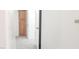 Hallway featuring gray carpet with a storage cupboard at 5710 E Tropicana Ave # 2178, Las Vegas, NV 89122