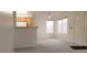Bright living room with plush carpet, natural light from two windows, and a ceiling fan for added comfort at 5710 E Tropicana Ave # 2178, Las Vegas, NV 89122
