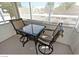 Enclosed patio with a table and chairs, perfect for relaxing outdoors at 5710 E Tropicana Ave # 2178, Las Vegas, NV 89122