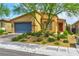 Charming single story home with landscaped front yard and shade tree at 5854 Olivine Falls Ave, Las Vegas, NV 89130