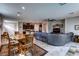 Open concept living space with tile floors that connect to the kitchen and dining areas at 5854 Olivine Falls Ave, Las Vegas, NV 89130