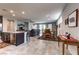 Open concept living space with tile floors that connect to the kitchen and dining areas at 5854 Olivine Falls Ave, Las Vegas, NV 89130