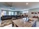 Open concept living space with tile floors that connect to the kitchen and dining areas at 5854 Olivine Falls Ave, Las Vegas, NV 89130
