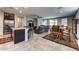 Open concept living space with tile floors, with view of kitchen, dining, and Gathering area at 5854 Olivine Falls Ave, Las Vegas, NV 89130