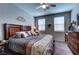 Relaxing main bedroom features a ceiling fan, comfortable bedding and stylish decor at 5854 Olivine Falls Ave, Las Vegas, NV 89130