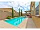 Beautiful backyard pool with professional landscaping, patio and outdoor seating area at 5854 Olivine Falls Ave, Las Vegas, NV 89130