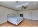 Bedroom with wood-look flooring, a ceiling fan, and a fireplace at 6 High Sierra Dr, Henderson, NV 89074